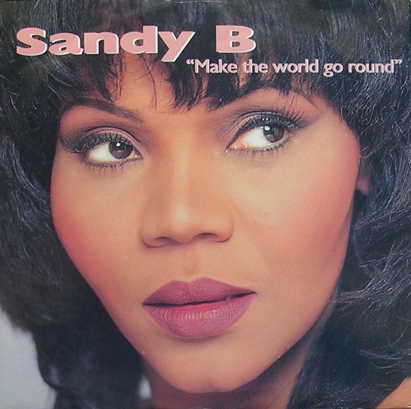 Make The World Go Round by Sandy B